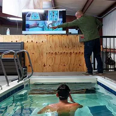 A SwimTec swimmer in the pool